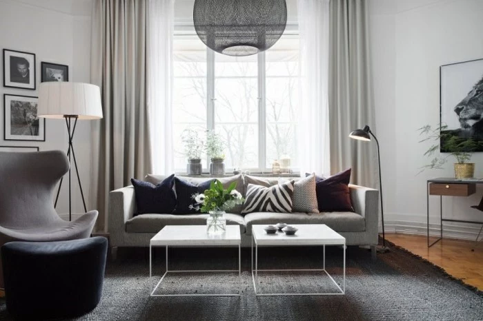 grey carpet, grey sofa and armchair, gray and white living room, white metal coffee tables