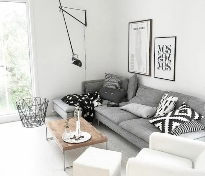 accent colors for gray, grey corner sofa, white armchair and ottoman, wooden coffee table, framed hanging art