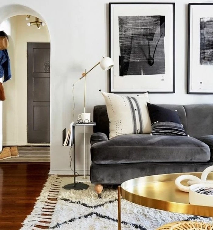 beautiful living rooms, grey velvet sofa, brass coffee table, white walls, wooden floor, white carpet