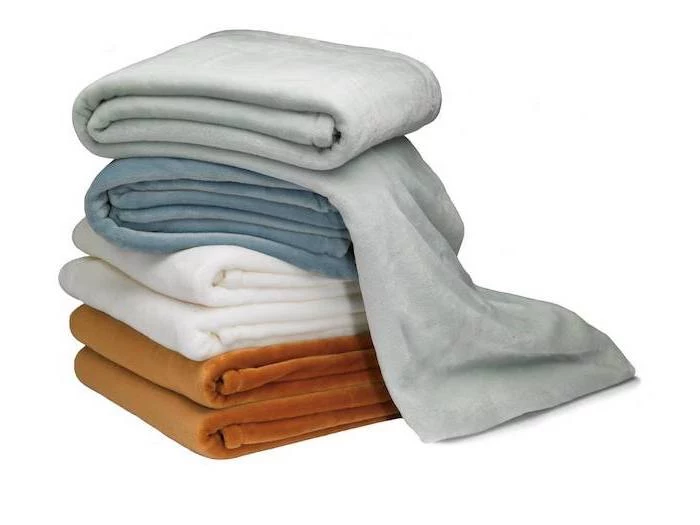 set of blankets, practical housewarming gifts, white and brown, grey and blue blankets