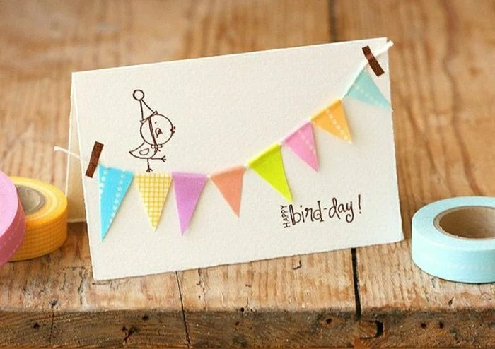 happy bird day, colourful hanging garland, birthday card ideas for mom, wooden table, washi tape