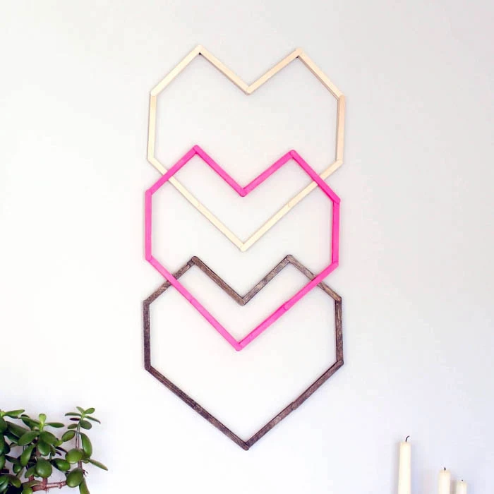 hanging on a white wall, three heart intertwined, beige pink and brown, canvas art ideas