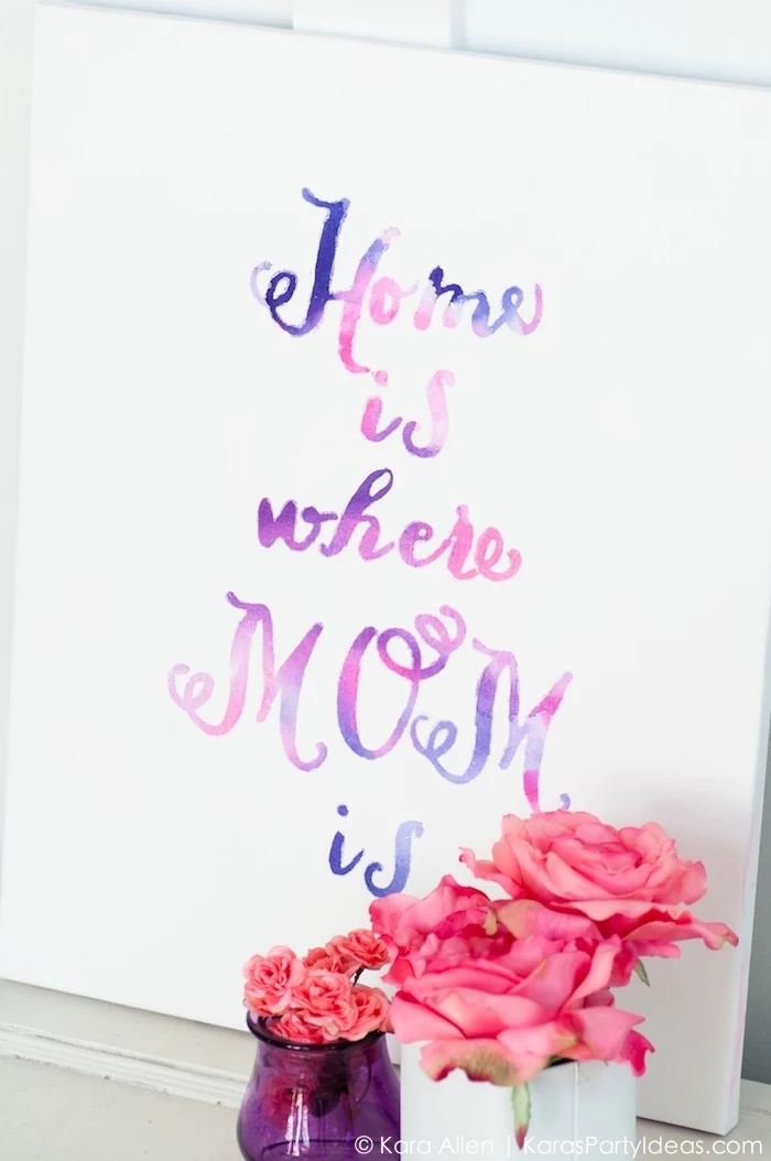 home is where mom is, pink and purple paint, white canvas, large wall decor ideas, vases of flowers