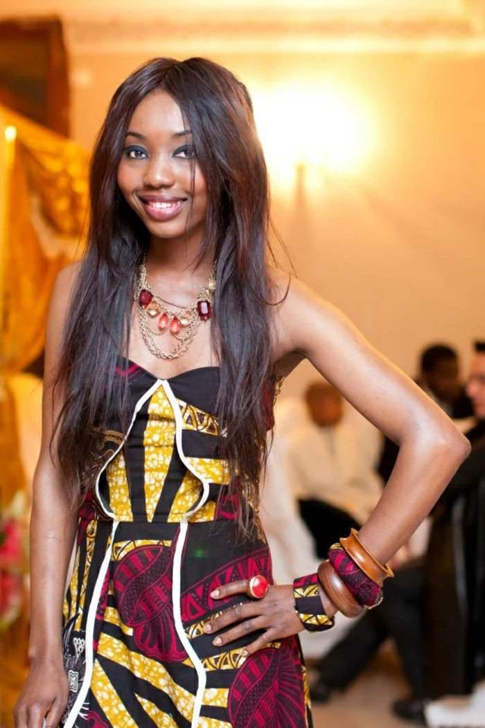 long black hair, long dress, large wooden bracelets, african dress designs, large golden necklace