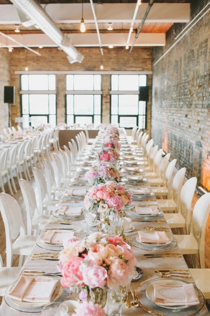 long dining table, bouquets of roses, center table decor, table settings, white chairs, industrial style