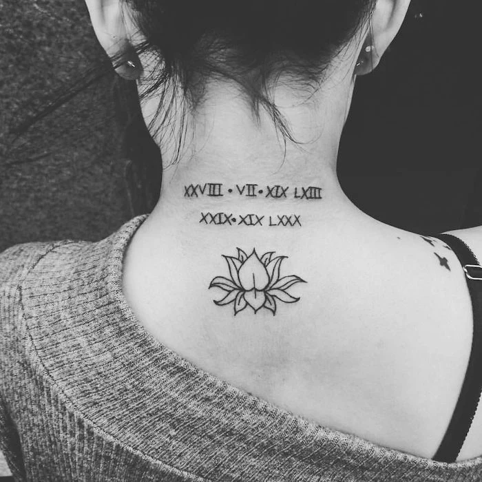 lotus flower, back tattoo, grey blouse, side arm tattoos, black hair