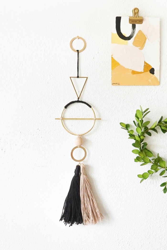 beige and black macrame tassel, abstract painting, greenery wreath, hanging on a wall, kitchen wall decor ideas
