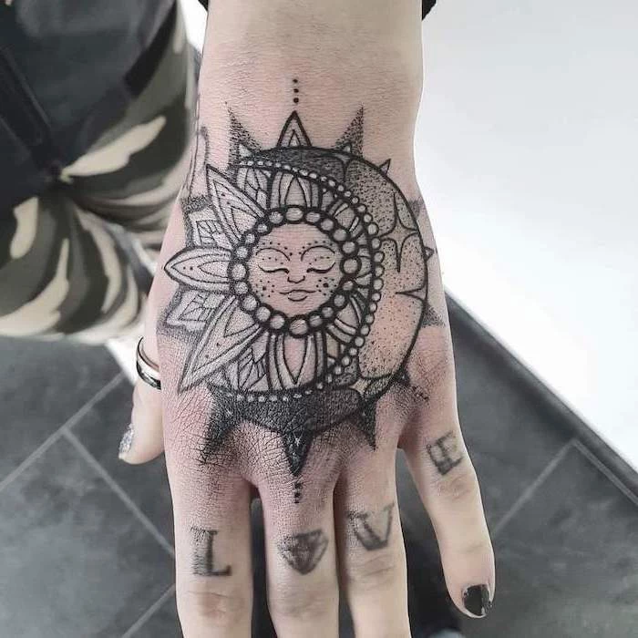 sun and moon, hand tattoo, love knuckles tattoo, what does mandala mean, black tiled floor, navy pants