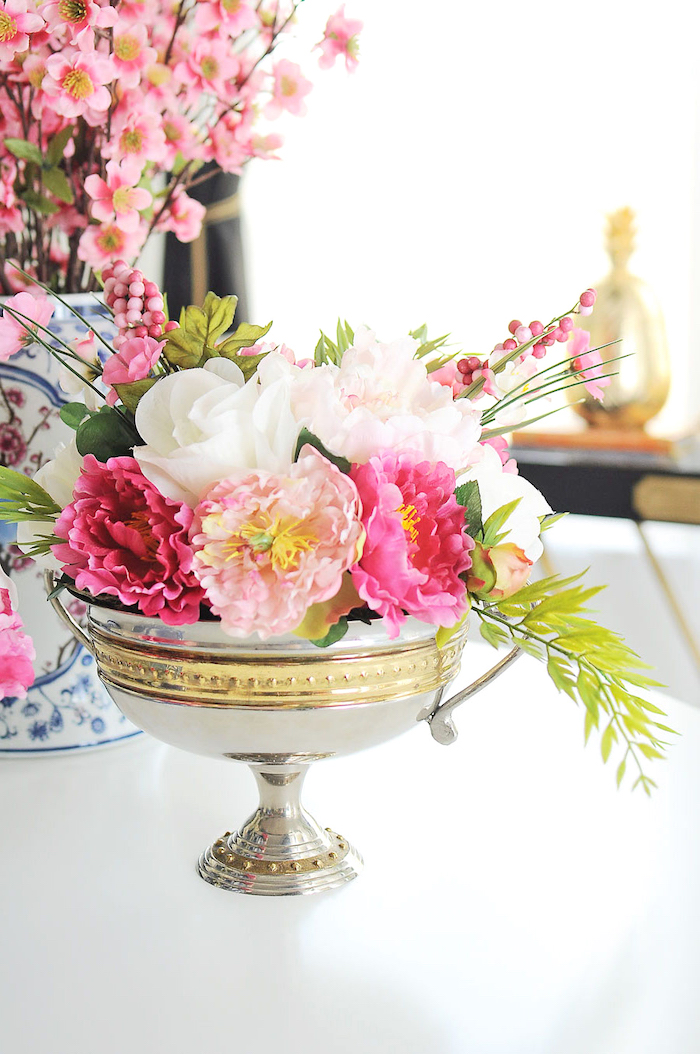 silver metal bowl, full of white and pink, flower bouquet, table centerpieces, white table