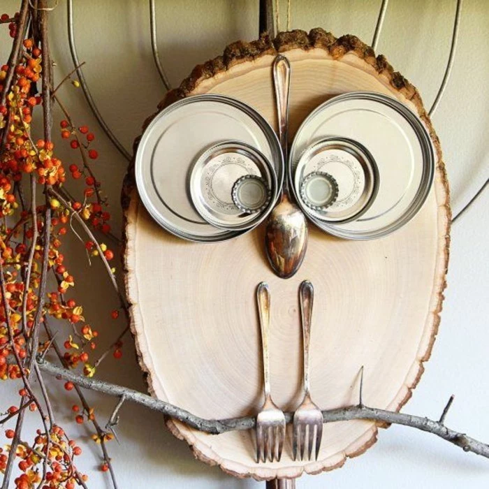 wooden block, metal plates stuck to it, in the shape of an owl, diy art projects, popped on a tree branch