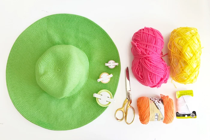 large green hat, yellow pink and orange yarn, diy anniversary gifts for him, step by step, diy tutorial