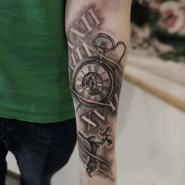 pocket watch and rabbits, forearm tattoo, roman numerals translation, green top and jeans