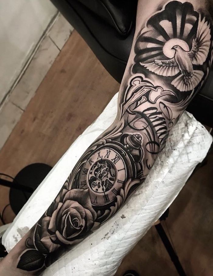 wooden floor, roman numbers tattoo, sleeve tattoo, white paper, pocket watch and roses