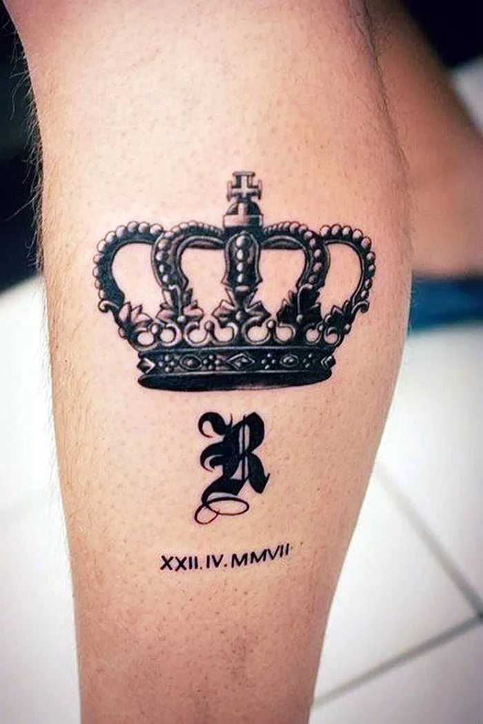 crown leg tattoo, roman numeral tattoos on arm, white tiled floor