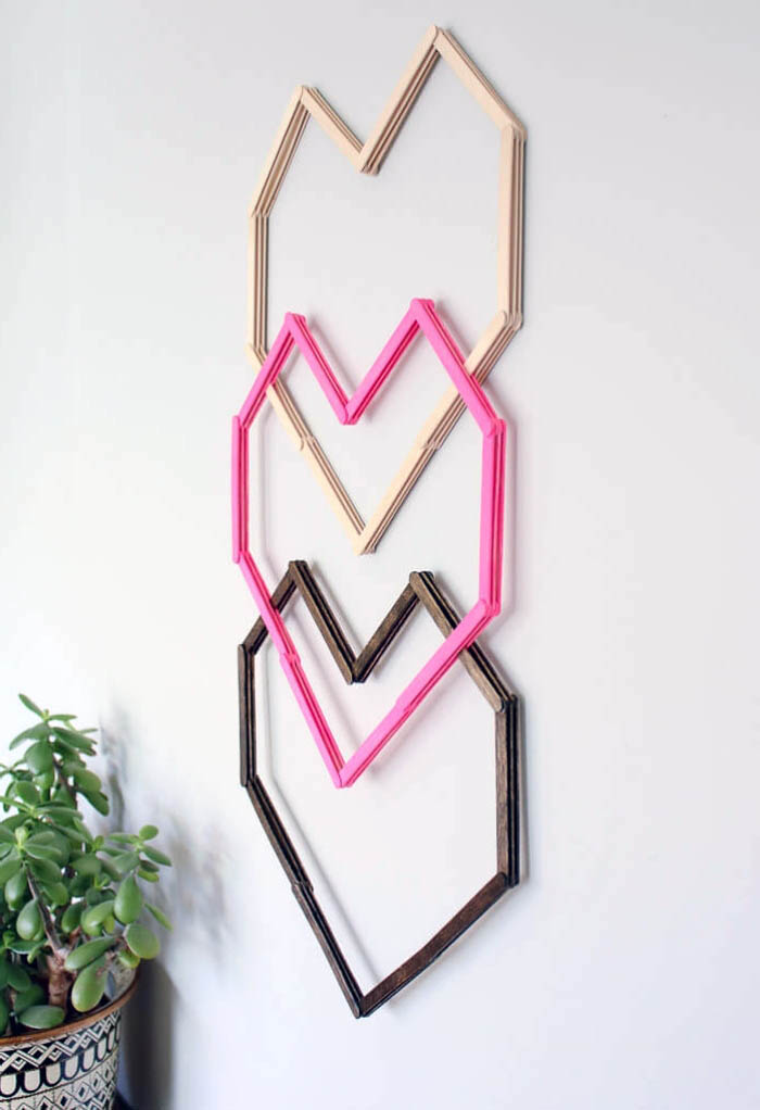 three heart intertwined, beige pink and brown, hanging on a white wall, girl room decor ideas