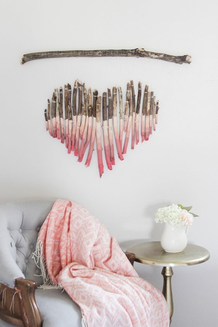 how to decorate a wall, heart shaped tree branches, painted in shades of pink, hanging on a white wall