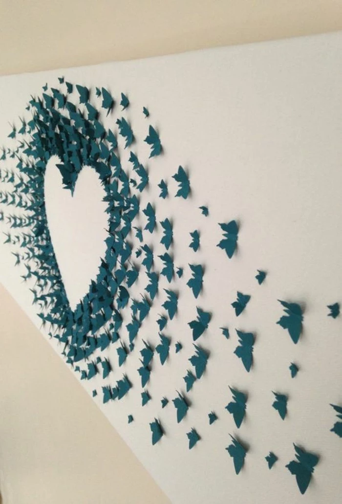 turquoise paper butterflies, outlining a heart, glued to a white wall, how to decorate a wall