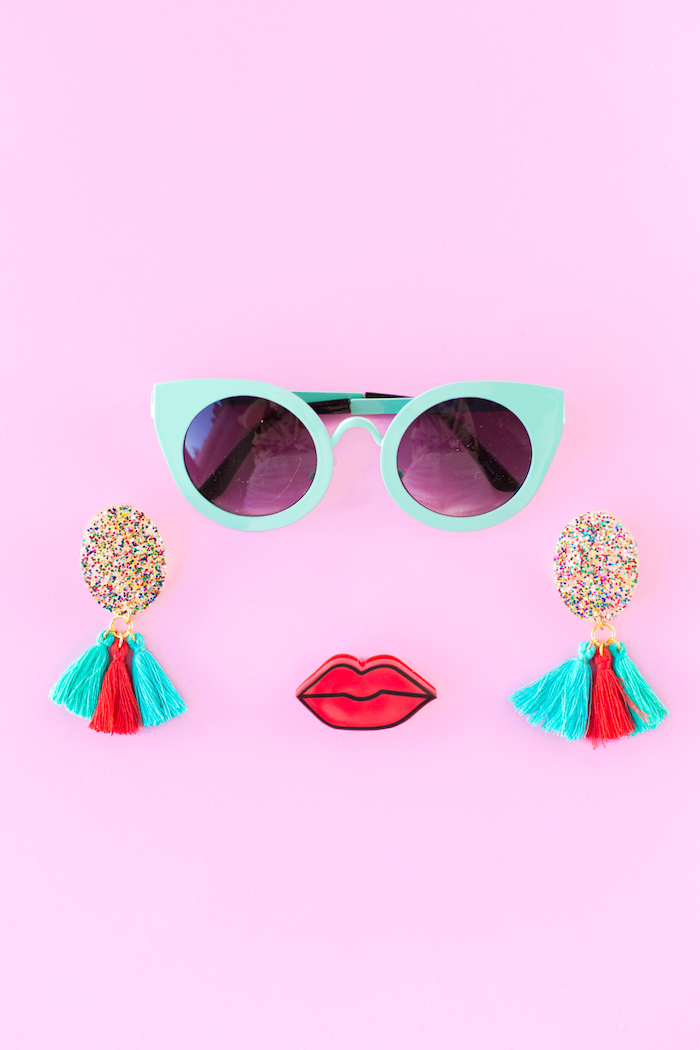 turquoise sunglasses, red lips, colourful tassels, colourful glitter, creative gift ideas, pink background