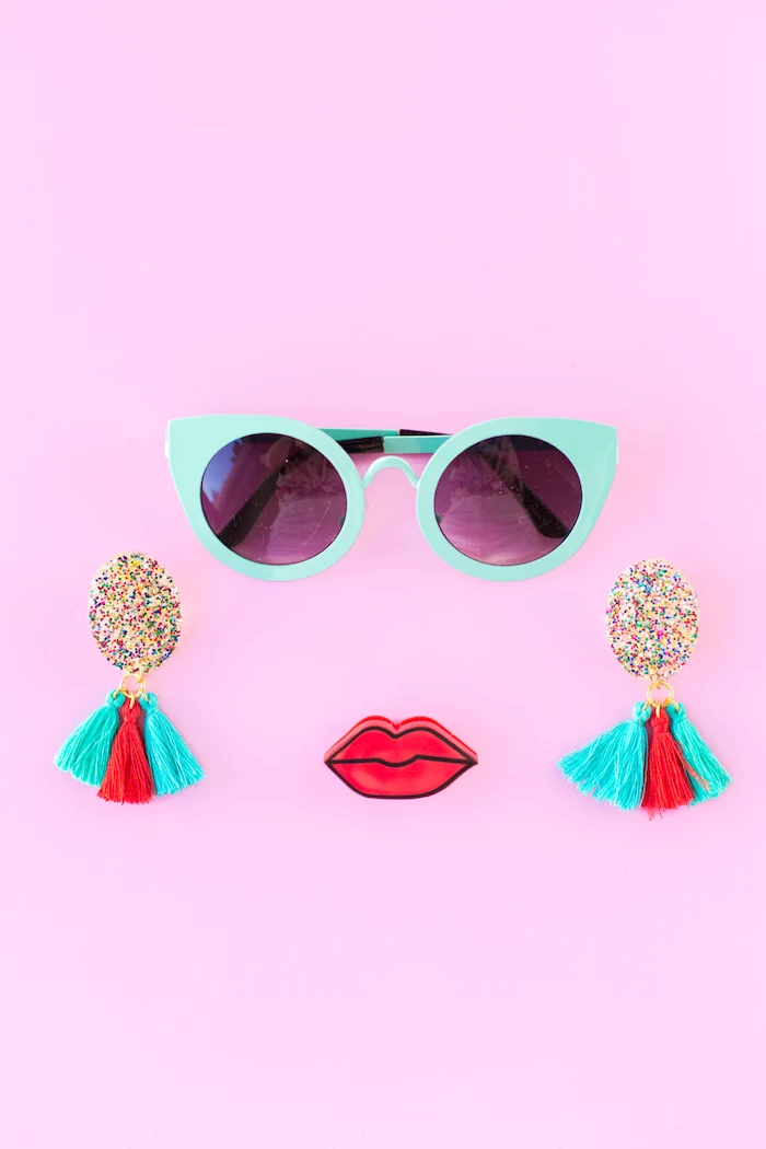 turquoise sunglasses, red lips, colourful tassels, colourful glitter, creative gift ideas, pink background