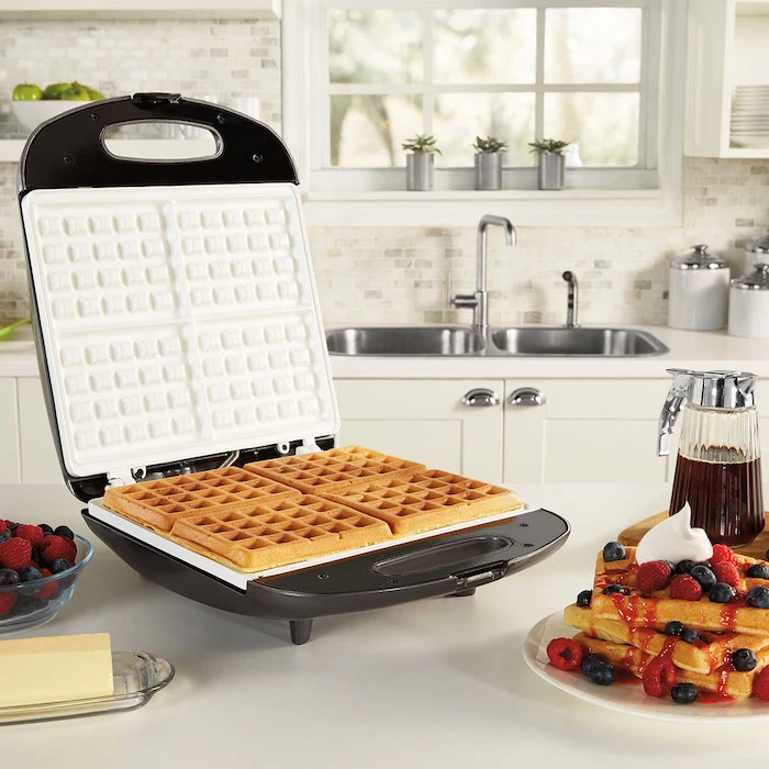 house warming present, waffle maker, maple syrup, strawberries and blueberries