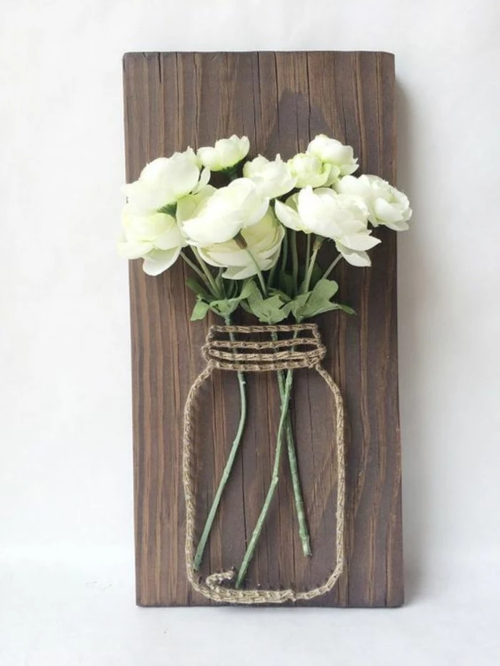 mason jar outline, made of rope and nails, bouquet of white roses, on a wooden board, large wall art ideas