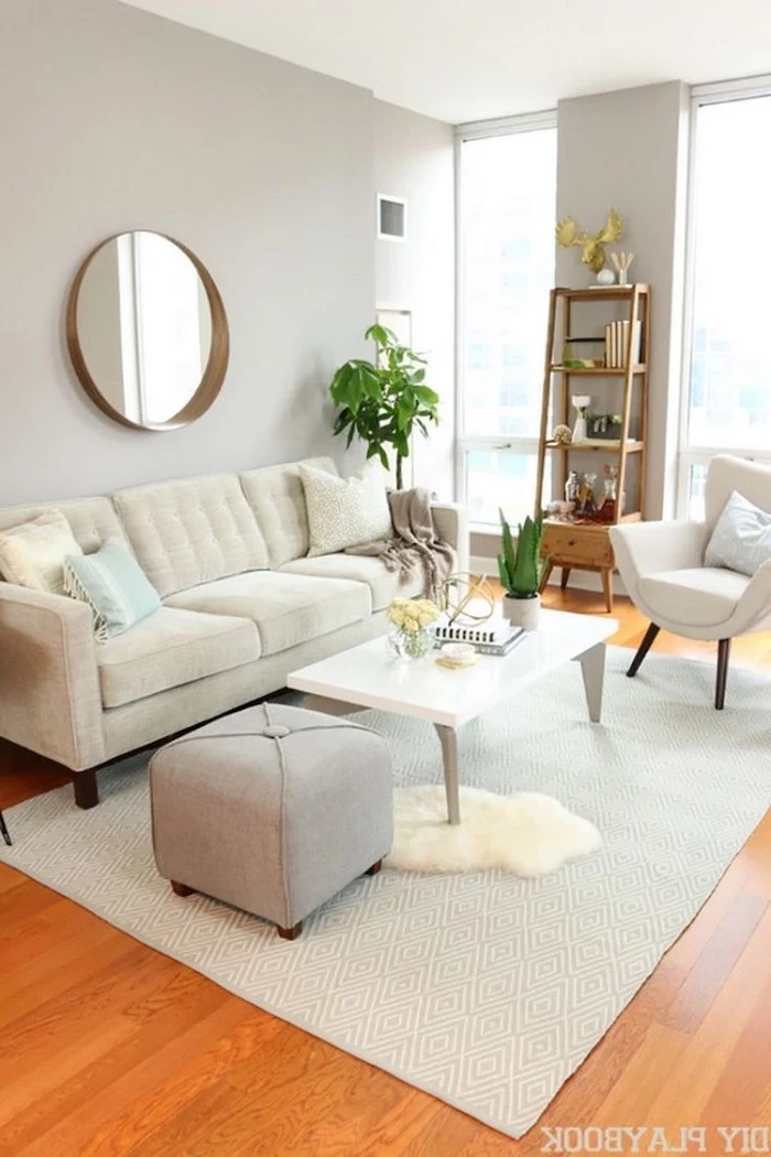 white sofa, grey ottoman, small living room furniture arrangement, white metal coffee table, white armchair