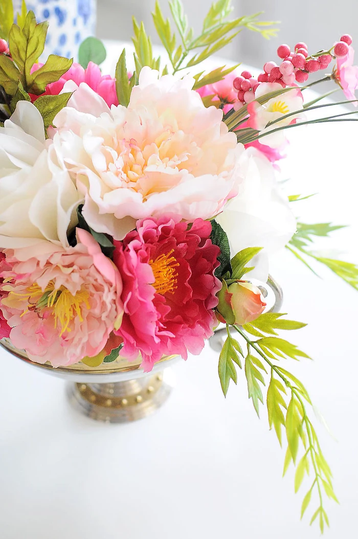 ppink adn white, flower bouquet, table centerpieces, inside a metal bowl, on a white table