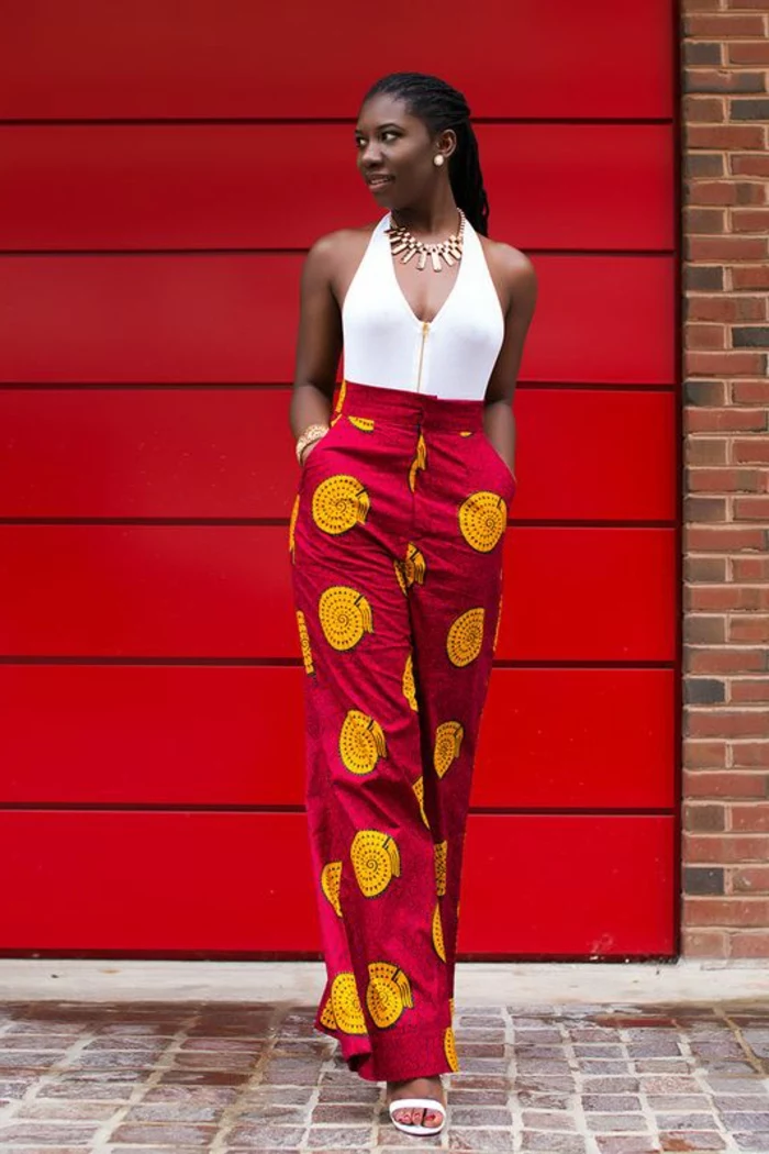red background, long trousers, white top, brick wall, african print maxi dresses