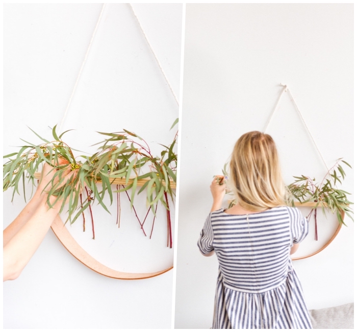 woman in a blue and white, striped dress, hanging a wooden pot of greenery, home wall decor