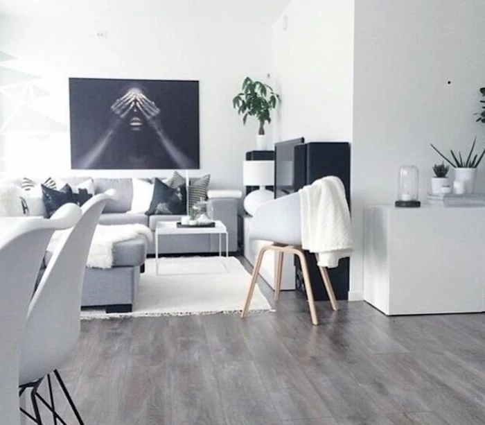 nice living rooms, grey corner sofa, printed throw pillows, wooden floor, white metal coffee table