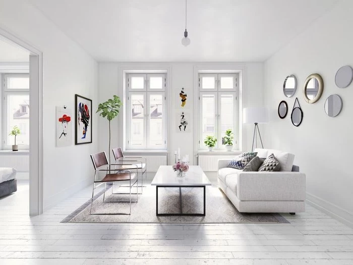white walls, living room dining room combo, white sofa, brown leather chairs, metal coffee table