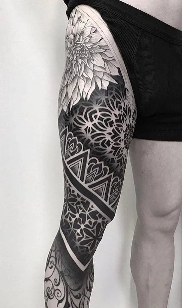 black boxers, white background, whole leg tattoo, small mandala tattoo