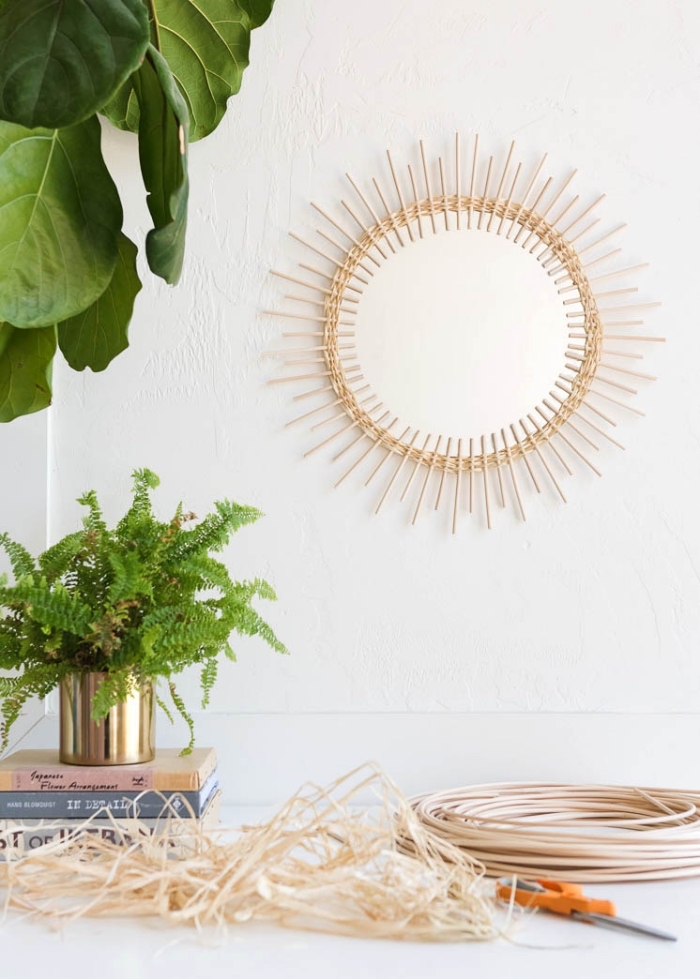 potted plants, round mirror, frame made out of wooden sticks, bedroom wall decor ideas, hanging on a white wall
