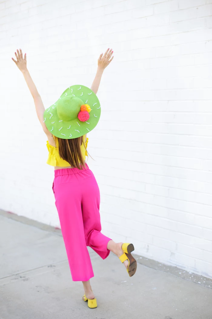 pink trousers, yellow top and shows, green hat, diy christmas gifts for mom, pink orange yellow pom poms