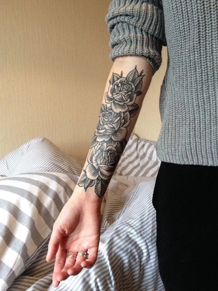 grey sweater, arm tattoos for women, three roses, forearm tattoo, black pants
