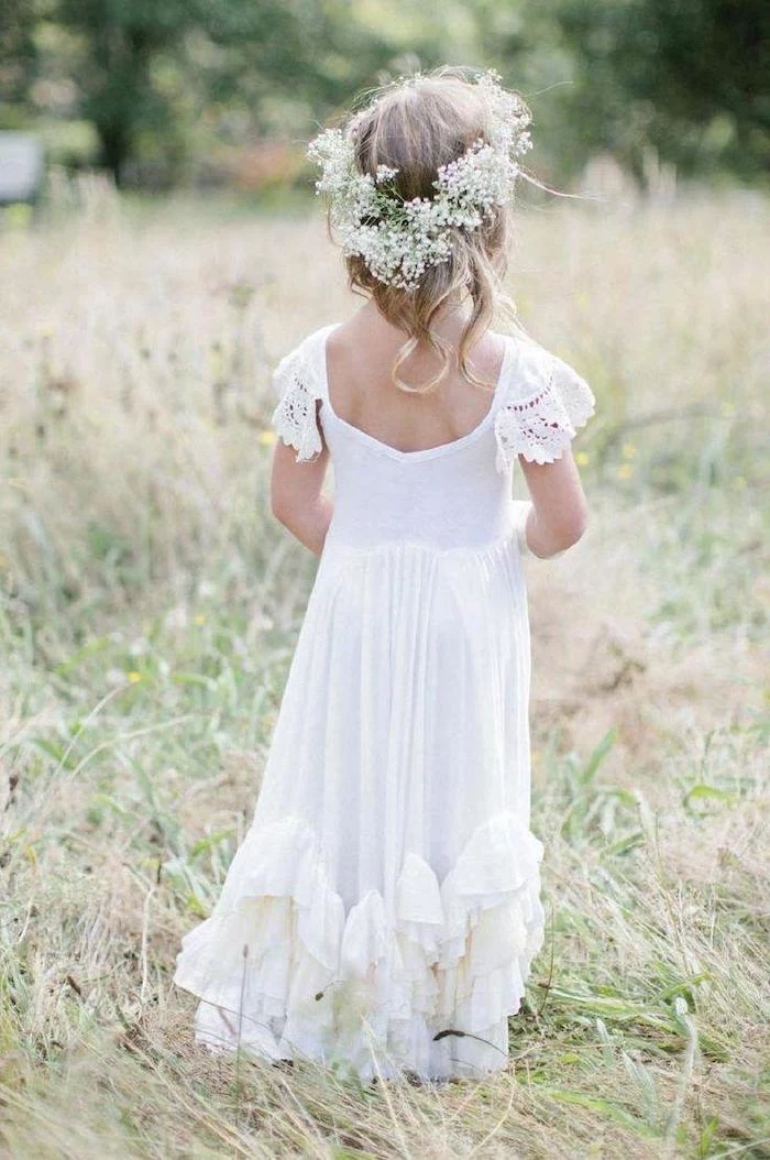 white long dress, baby's breath crown, flower girl shoes, blonde wavy hair, green grass