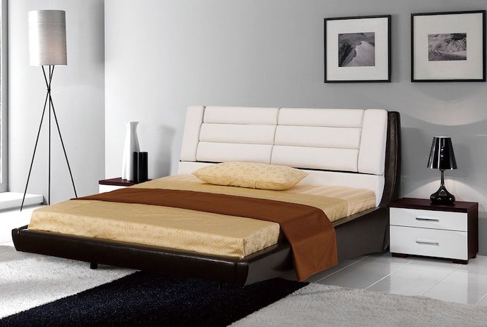 white leather head board, black bed frame, bedroom ideas for women, white walls, black and white carpet