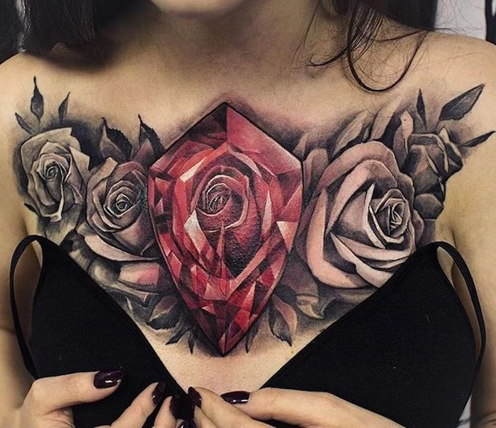 large red crystal, four roses, chest tattoo, cute tattoos for girls, black bra, black nail polish