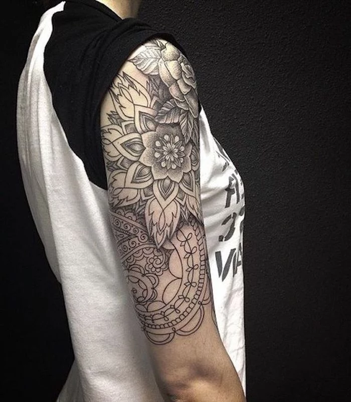 flower mandala tattoo, shoulder tattoo, cute tattoos for girls, black background, black and white shirt