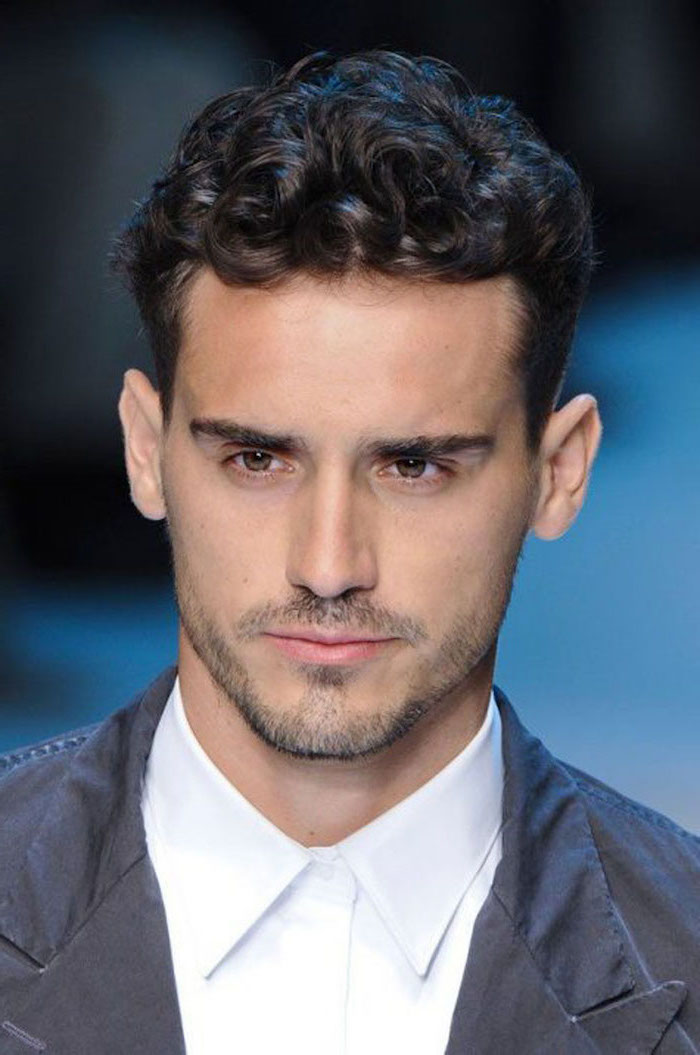 black curly hair, hairstyle for men, grey jacket, white shirt