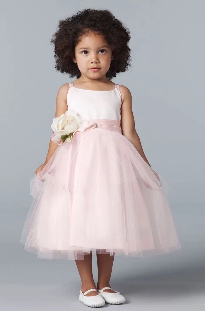 light pink tulle dress, flower girl dresses, white shoes, short black curly hair, pink rose on the ribbon belt