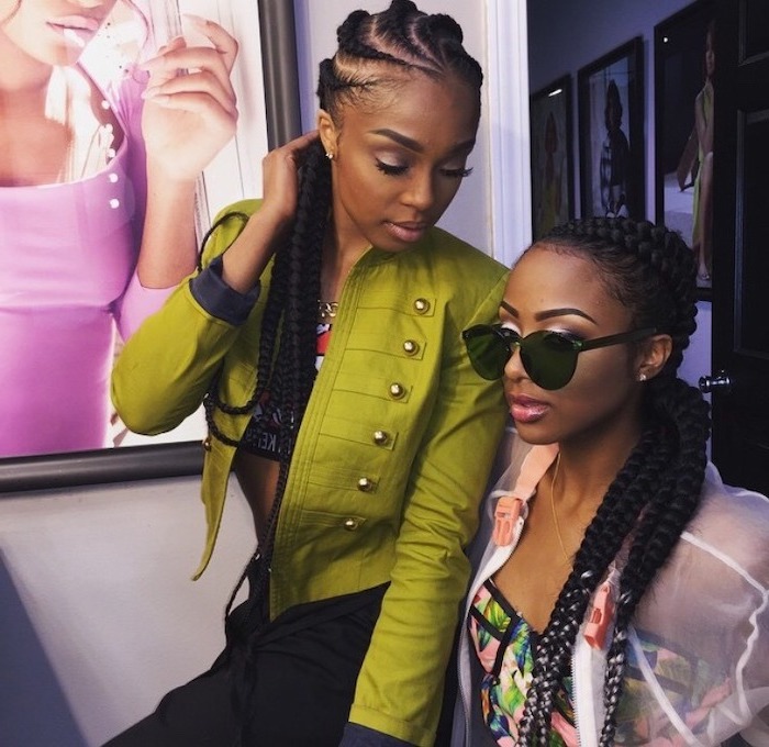 two women sitting next to each other, ghana braids, on black hair, one is wearing sunglasses