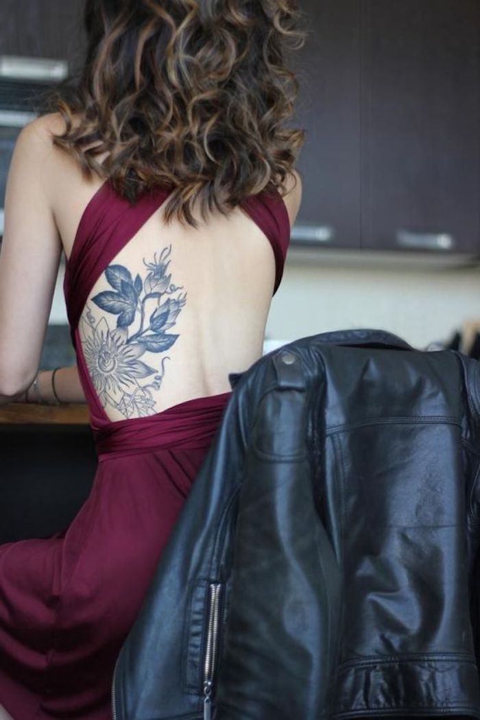 red burgundy dress, black leather jacket, floral rib cage tattoo, shoulder tattoos for girls