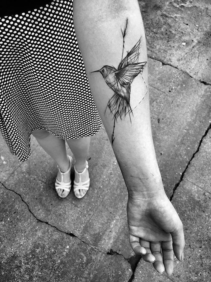 geometrical bird flying, meaningful tattoos, forearm tattoo, black and white photo