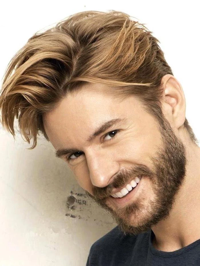 man smiling, black shirt, medium length hairstyles for men, blonde hair