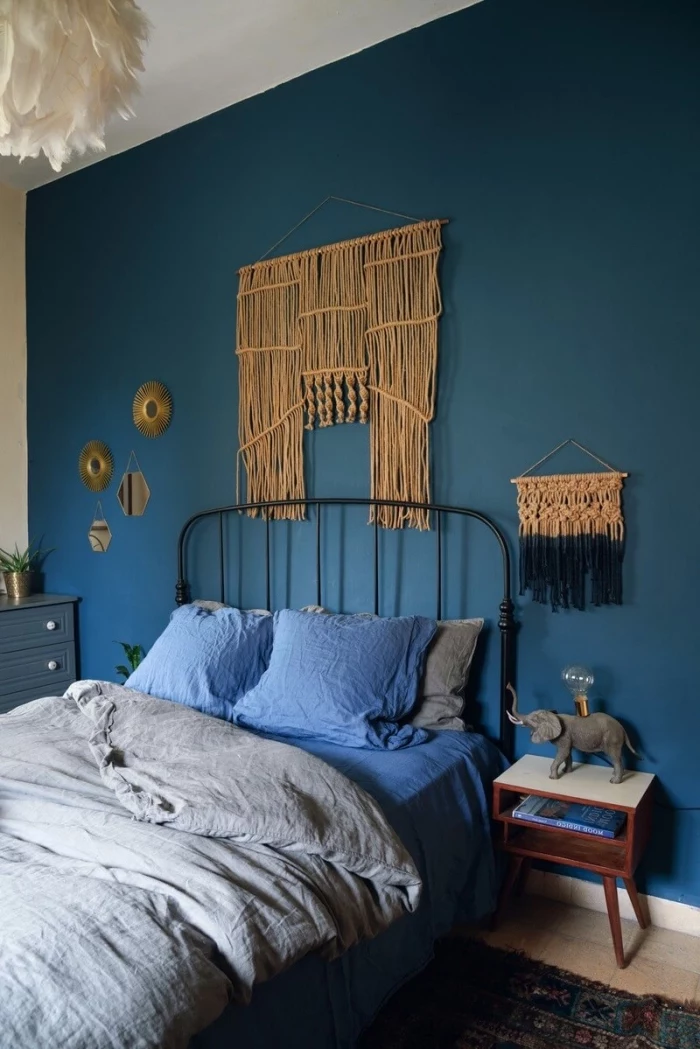 blue wall, blue pillows, free macrame patterns, wooden night stands, grey bed linen