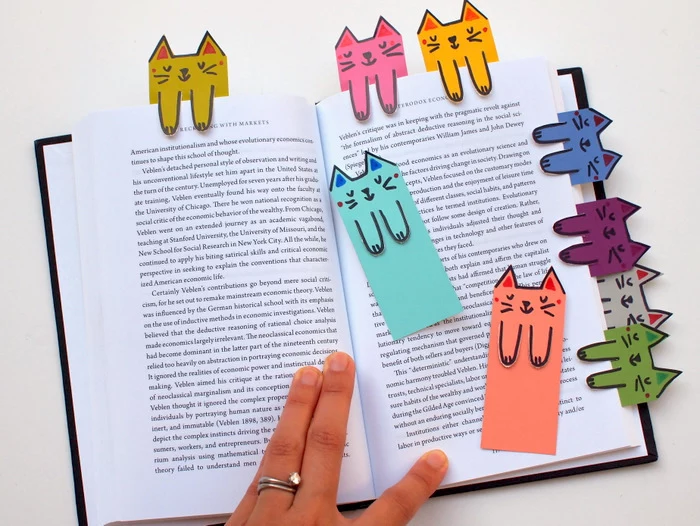 book dividers, made of colourful paper, with cat faces and paws drawn on it, pre k learning games