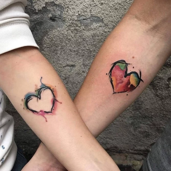 watercolour hearts, matching tattoos, forearm tattoos, cement background