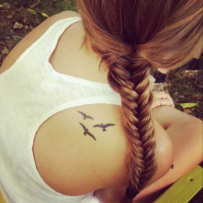 braided blonde hair, white top, birds flying, shoulder tattoo, arm tattoos for girls