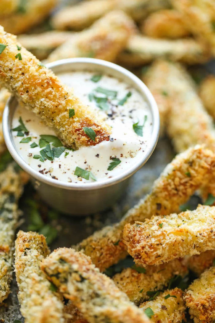 baked croquettes, sour cream and chives, in a metal bowl, dairy free appetizers